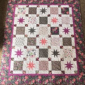 Floral Rock My Star Way throw sized quilt.